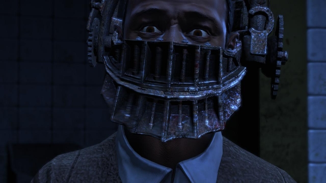 Saw: The Video Game: face in the device screenshot